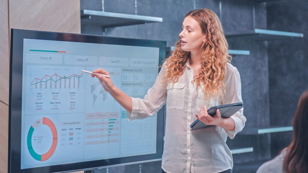 image of a woman analyzing data and graphs for insights on association success
